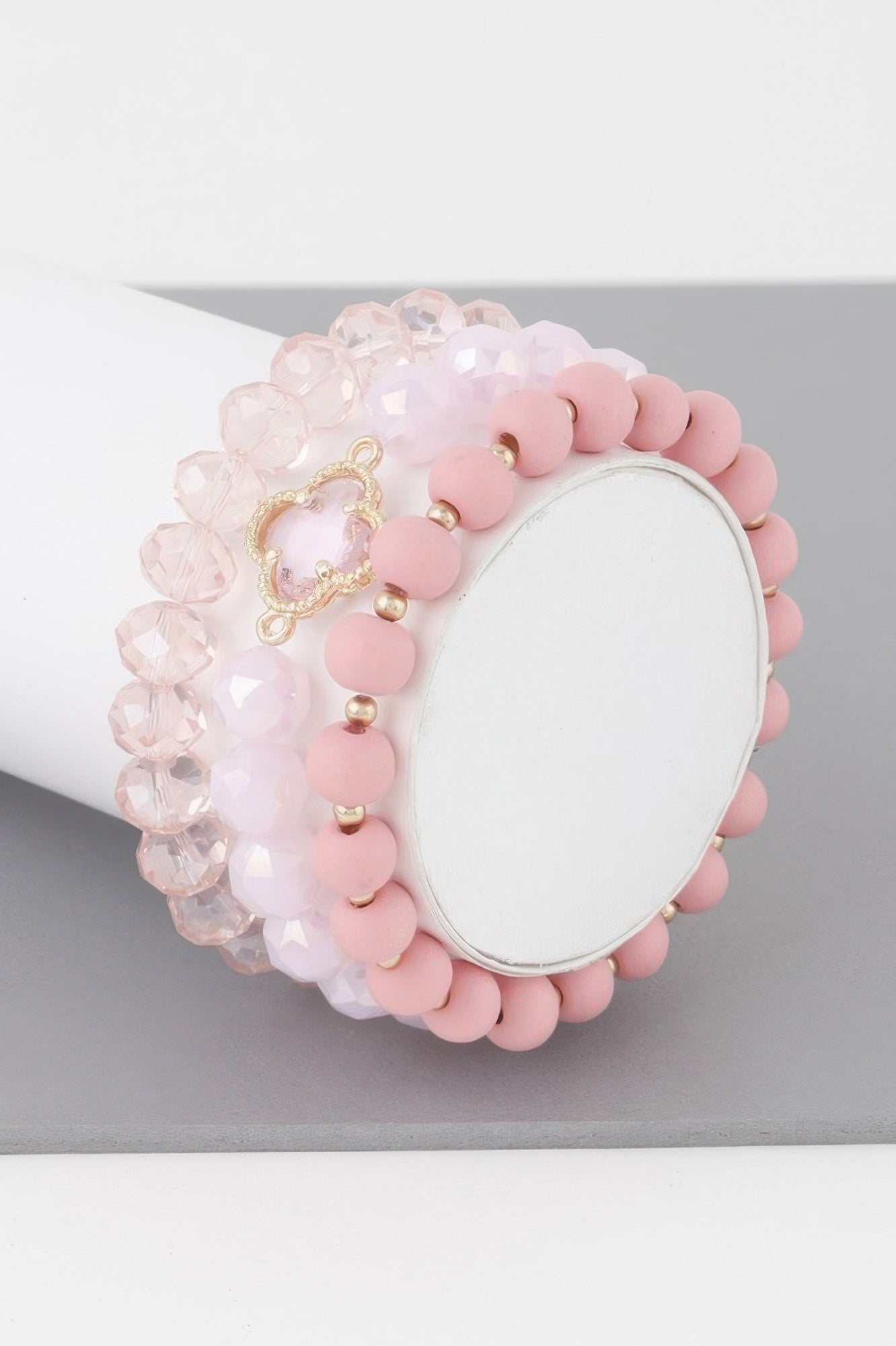 Pink beaded clover crystal bracelet with gold-toned clover charm and crystal bead strand