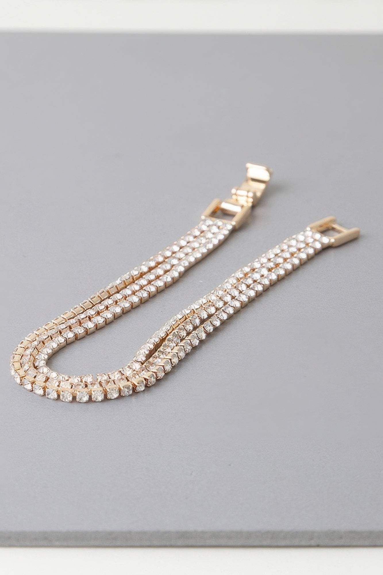 Triple Cubic Jewel Bracelet gold clear finish with triple-row sparkling stone links