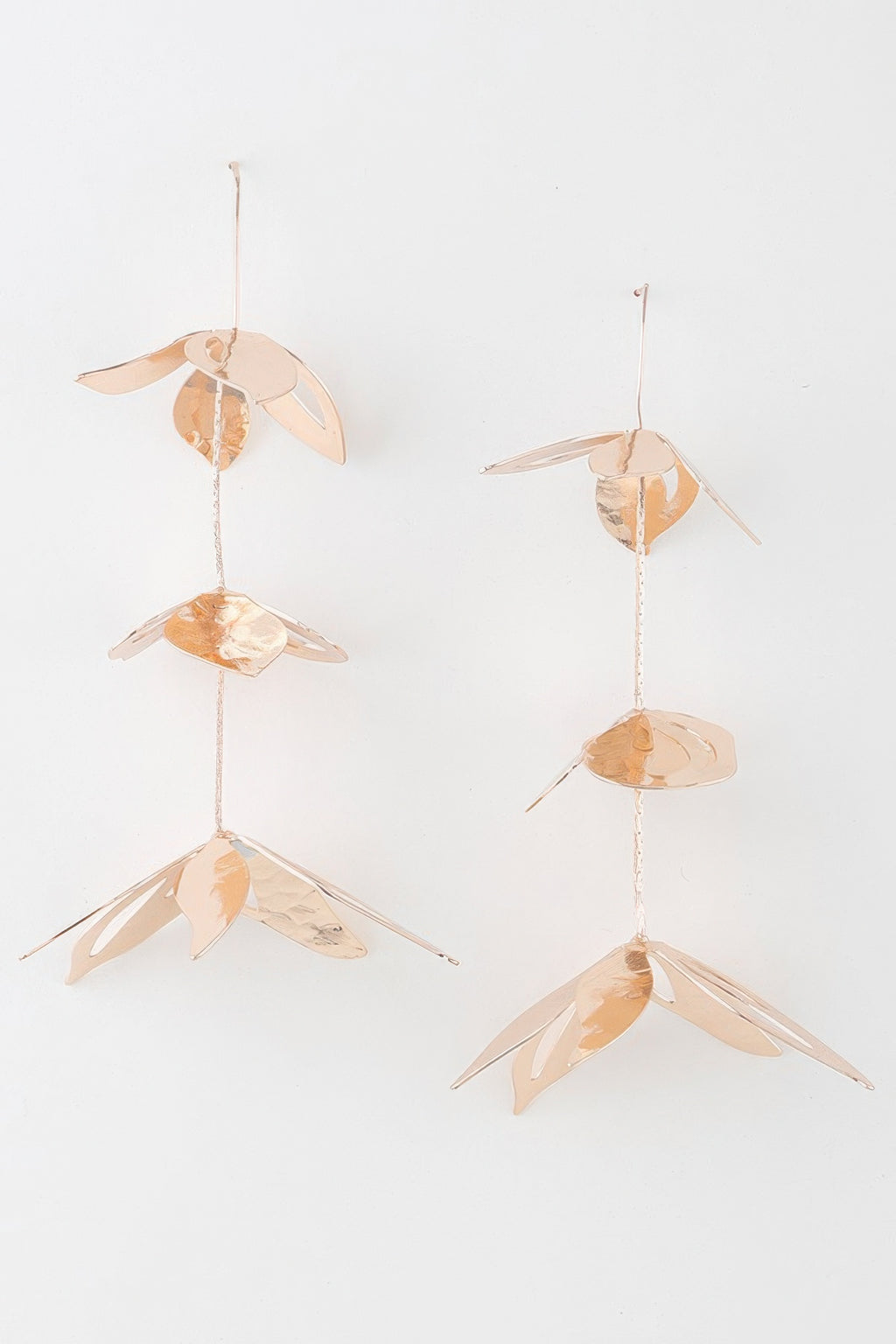 Gold triple delicate flower drop earrings with three hanging petals