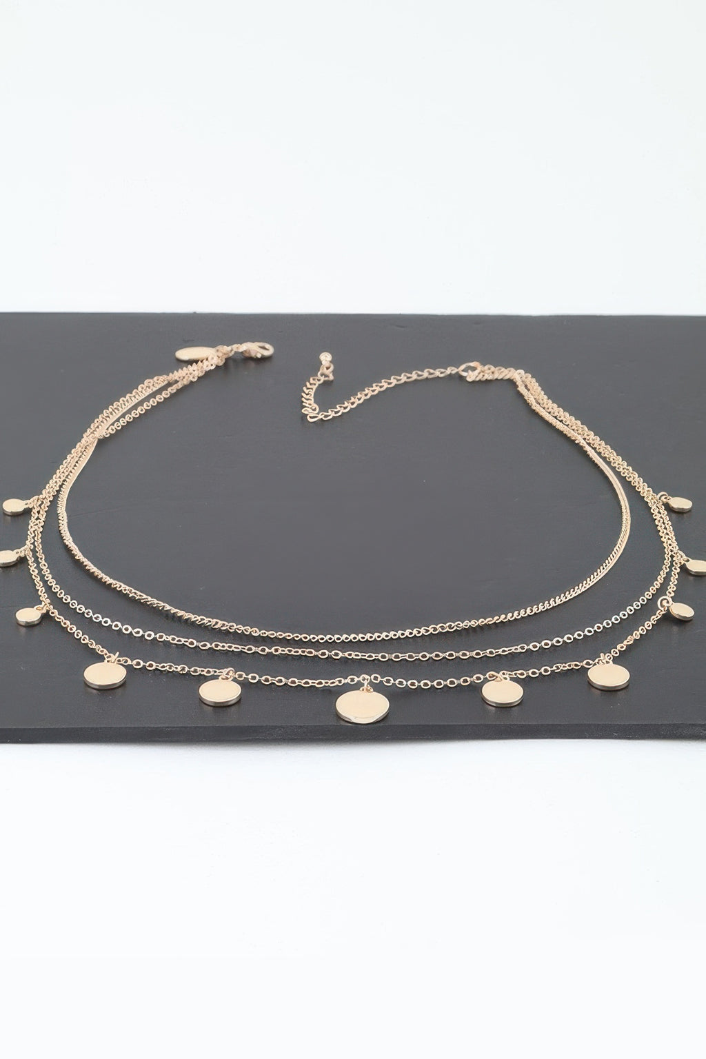 Gold-tone triple round charm chain necklace with multiple round disc pendants
