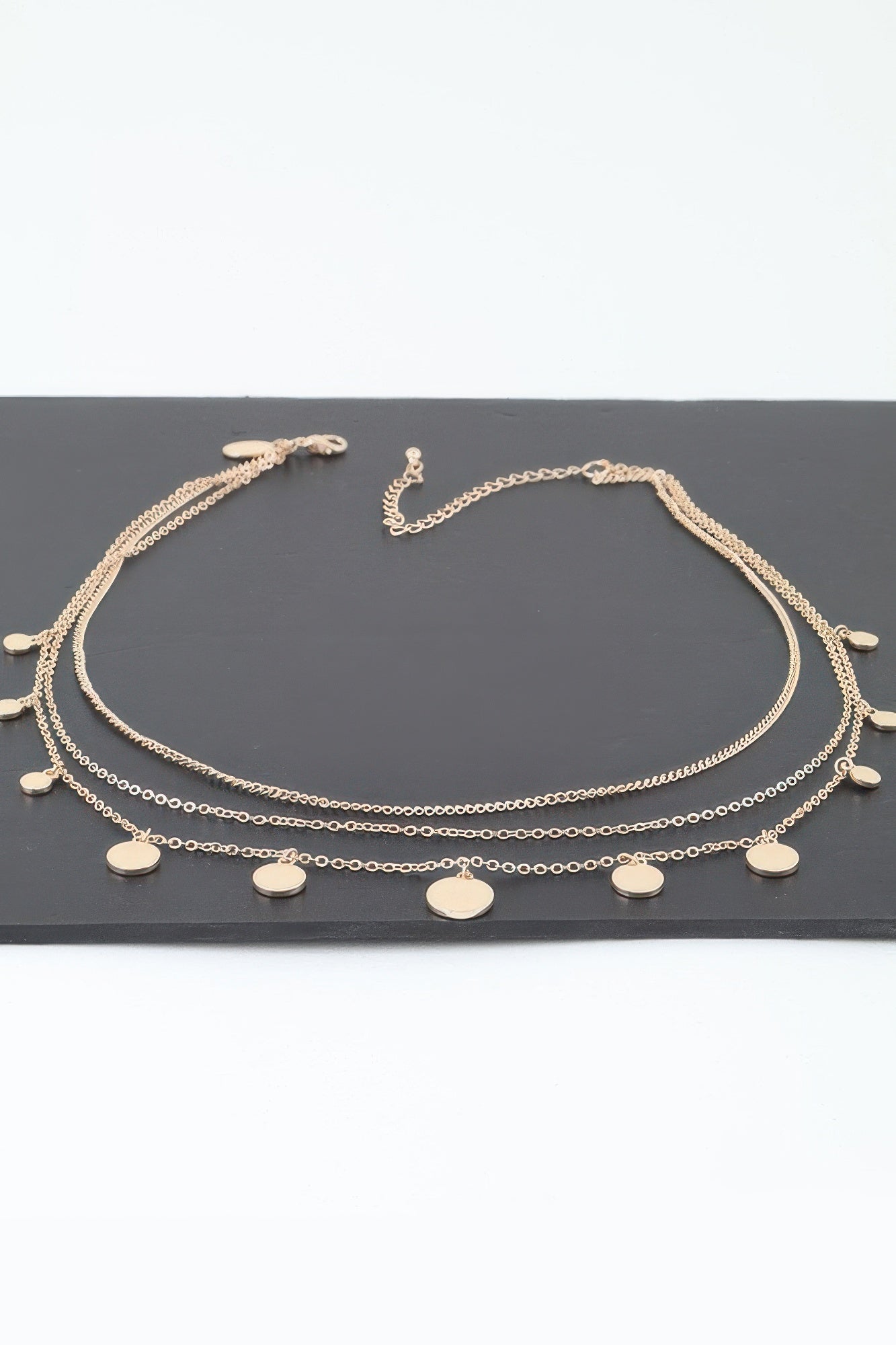 Gold-tone triple round charm chain necklace with multiple round disc pendants
