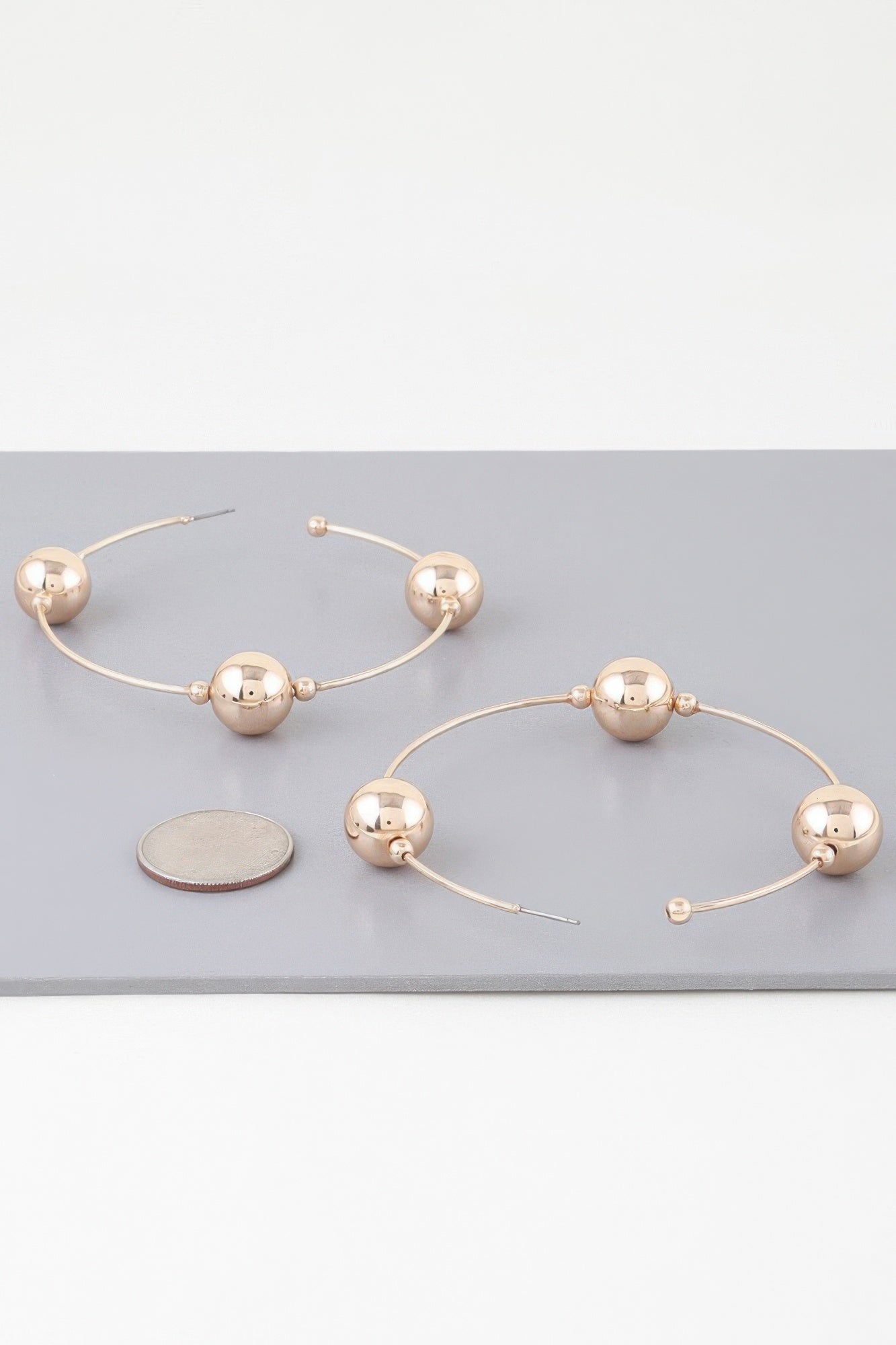 Triple shiny bead hoop earrings, gold-tone pair with small ball posts