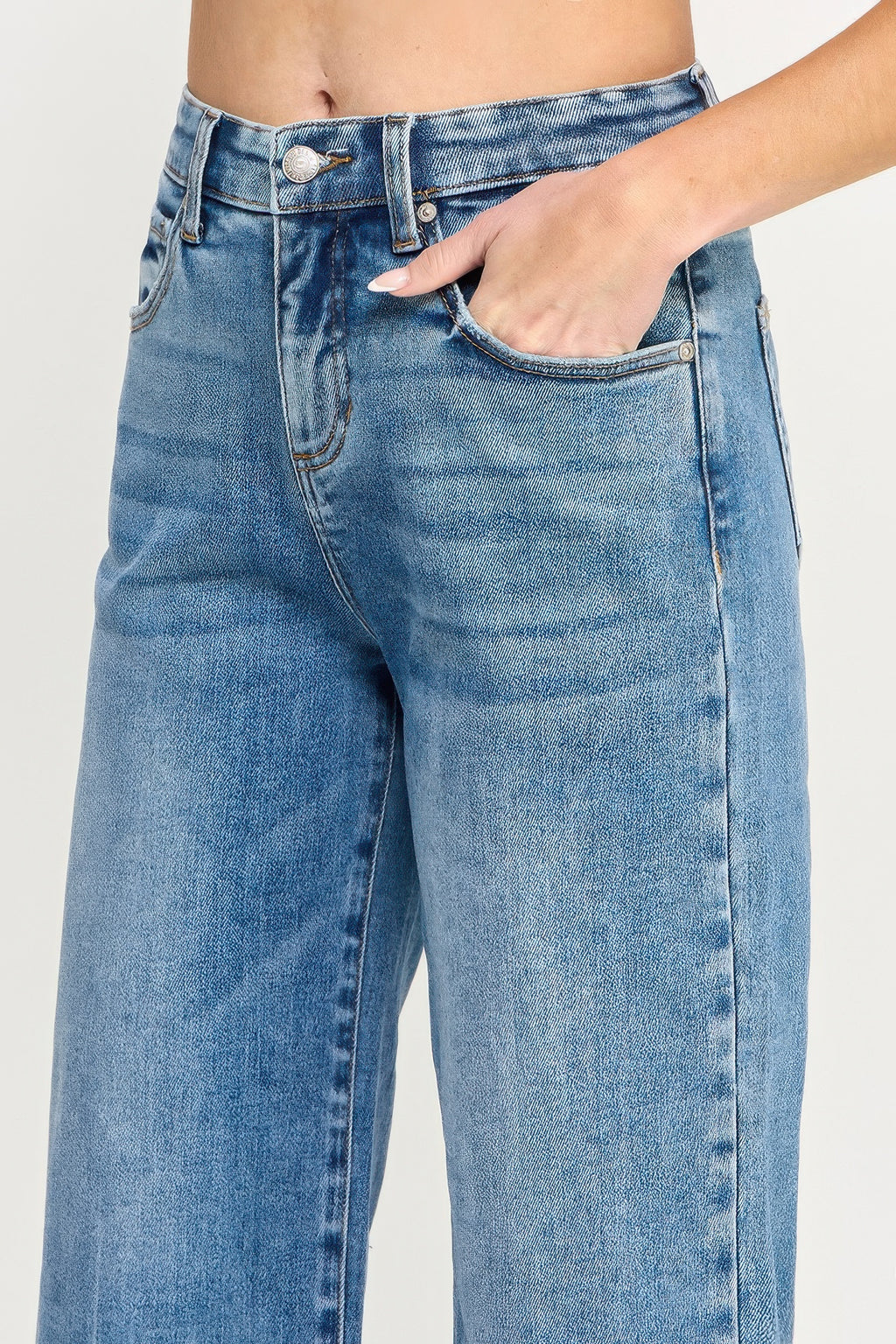 Blue high-rise wide-leg jeans with button fly and front pocket seams