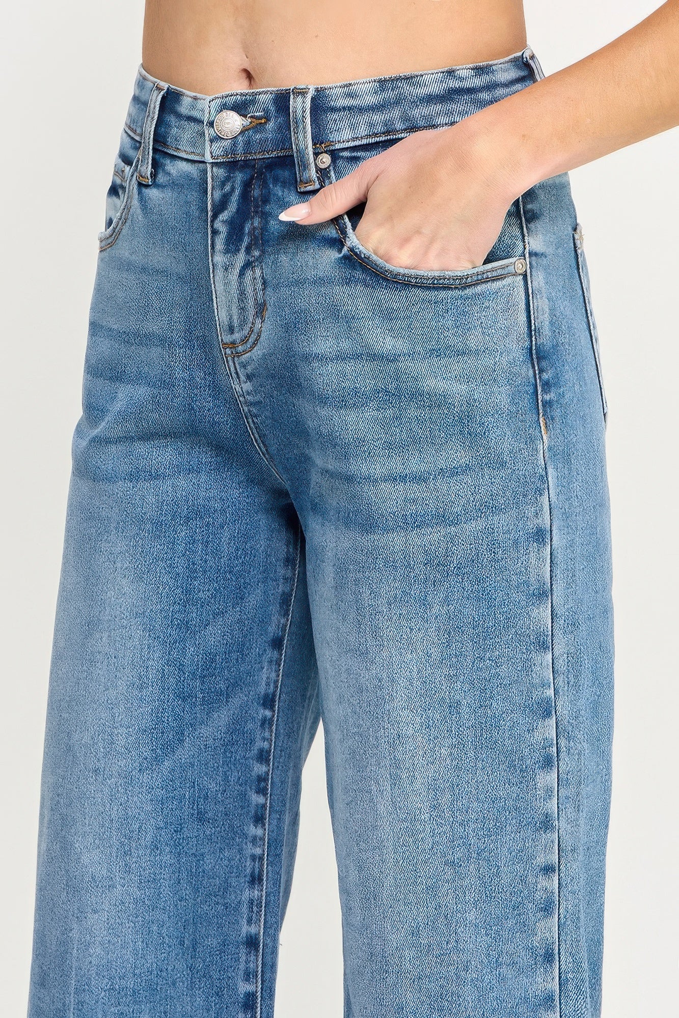Blue high-rise wide-leg jeans with button fly and front pocket seams