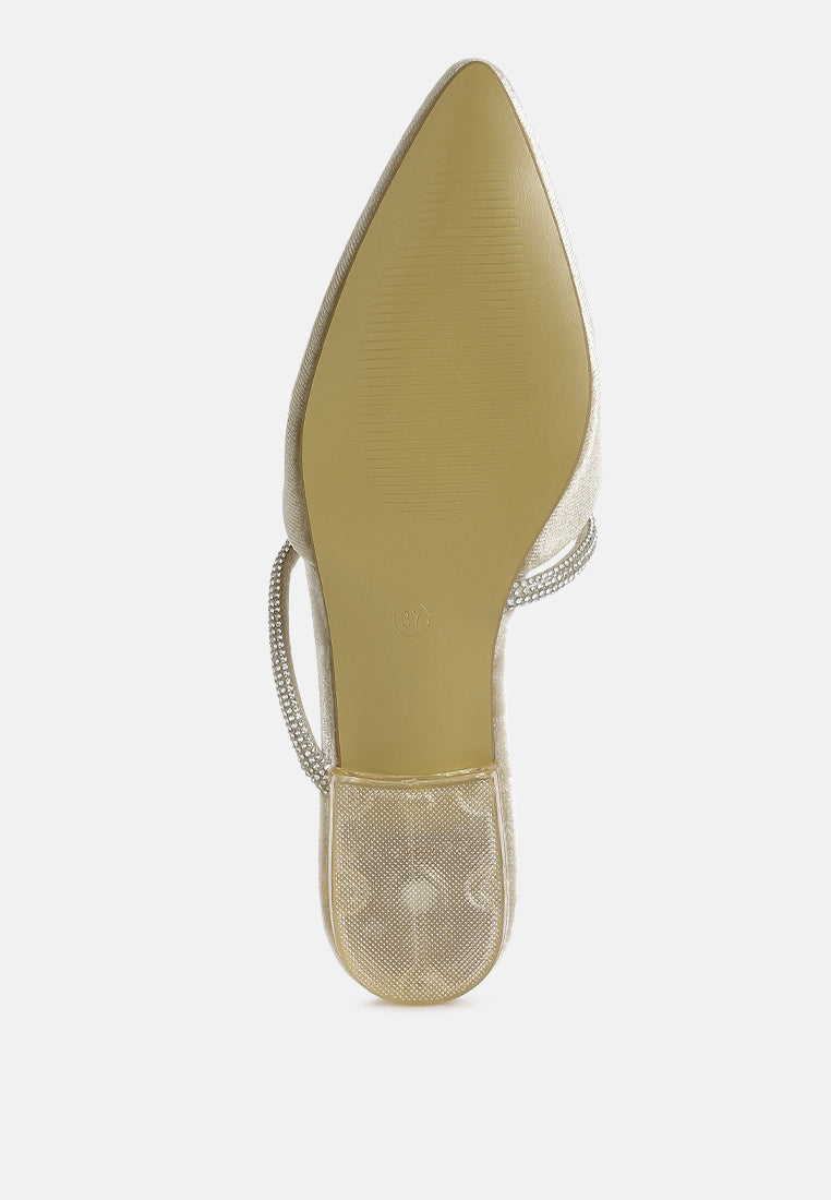 Latte velvet flat mule showing pointed toe and diamante sling strap detail