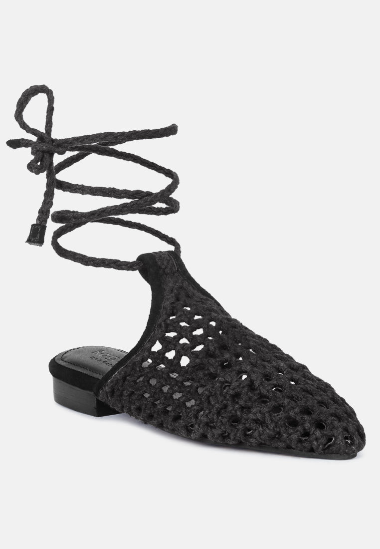 Black mule flat with openwork honeycomb knit and crisscross tie straps