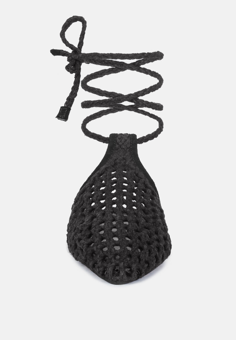 Black mule with gathered teardrop opening and woven honeycomb upper