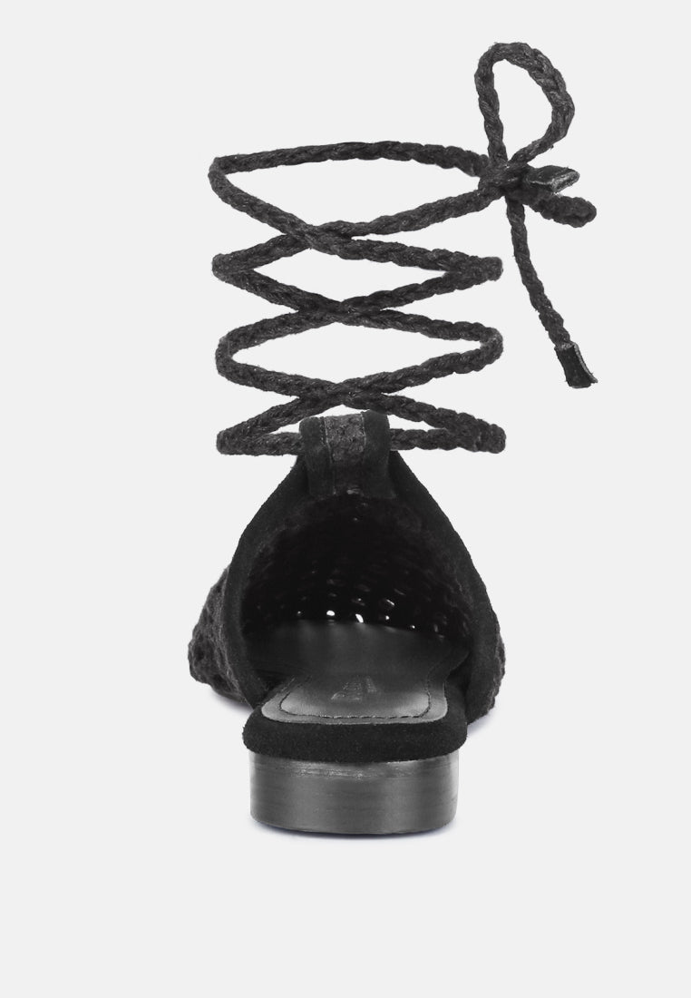 Black mule heel view with tie straps and low block heel