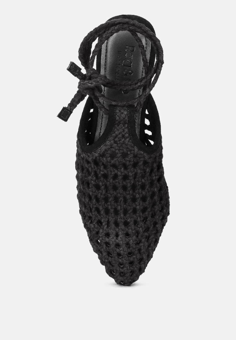 Black handwoven mule upper view with cutout honeycomb pattern