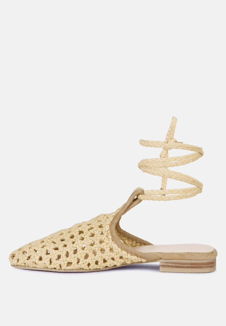 Nude side view mules with tie-up straps and flat block heel, honeycomb knit