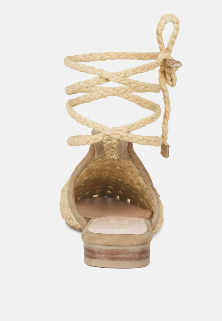 Nude mule flats back/heel view, woven upper and tie cords above block heel