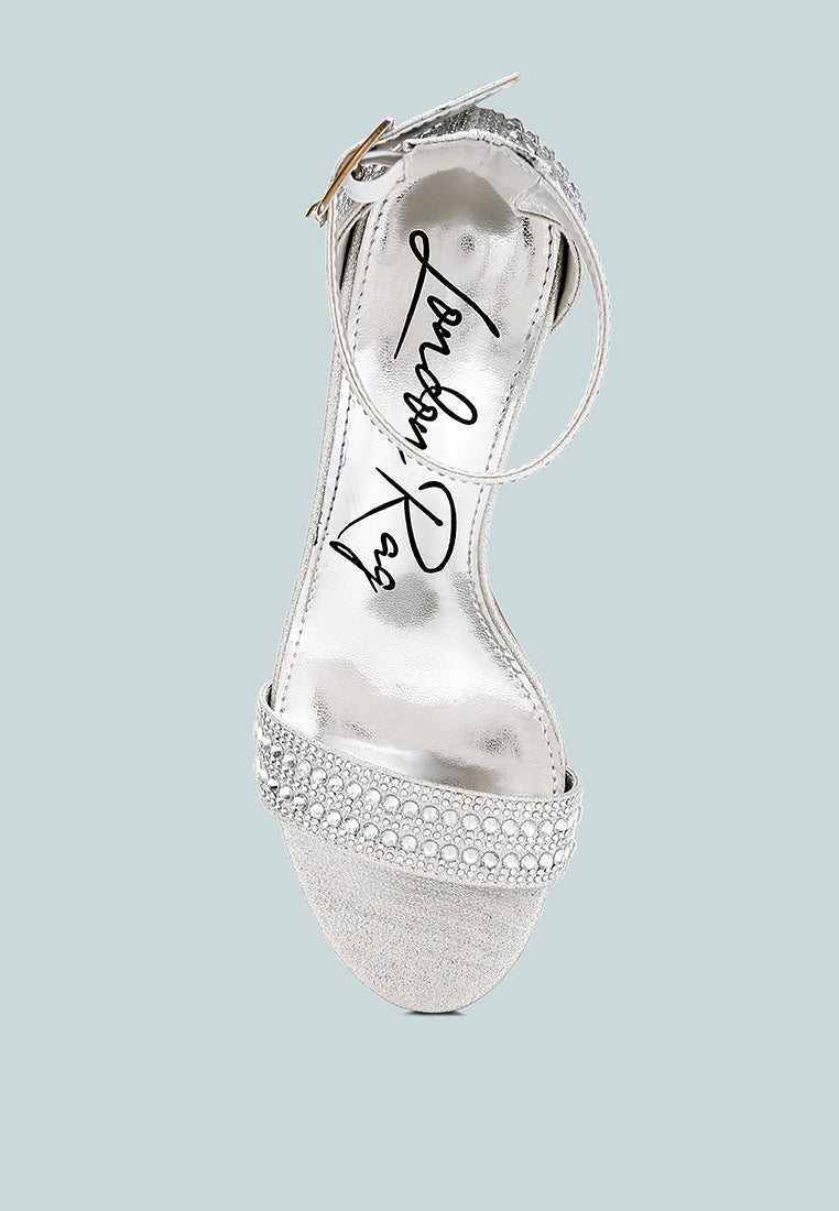 Twerky sandal back view: ankle strap with pin buckle and rhinestone trim, silver
