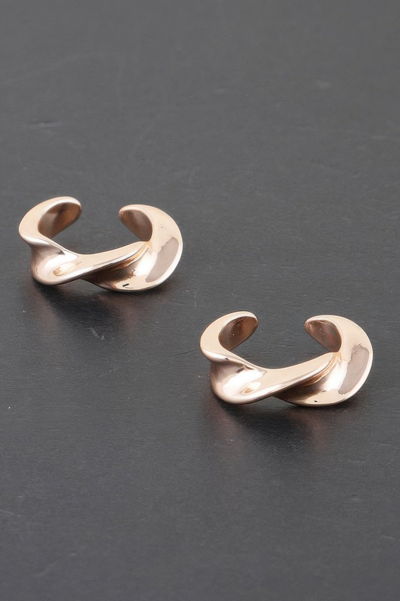 Twist of Elegance plated hoop earrings, gold-tone twisted open design