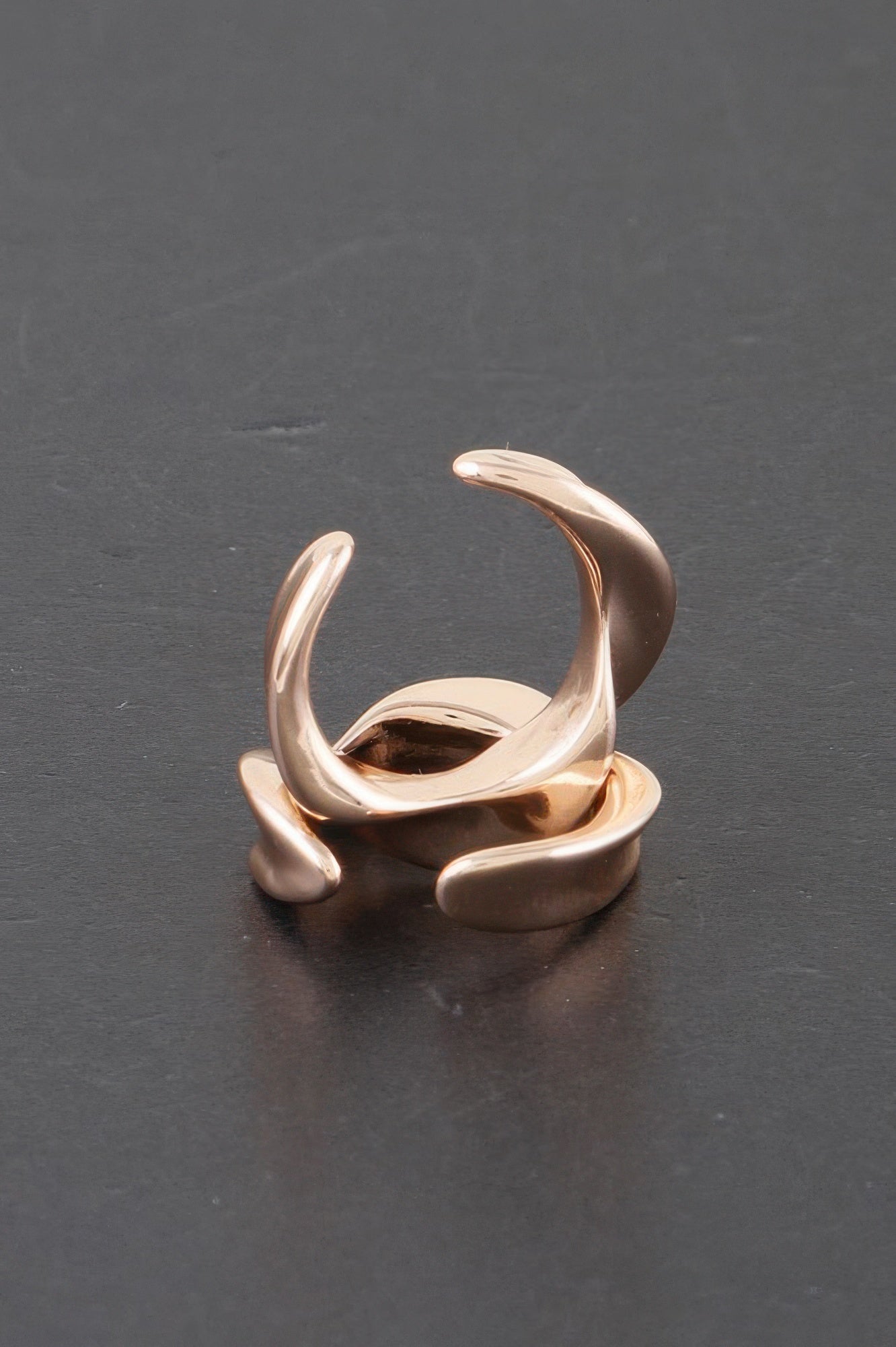 Gold-tone twisted open hoop earrings with glossy plated finish