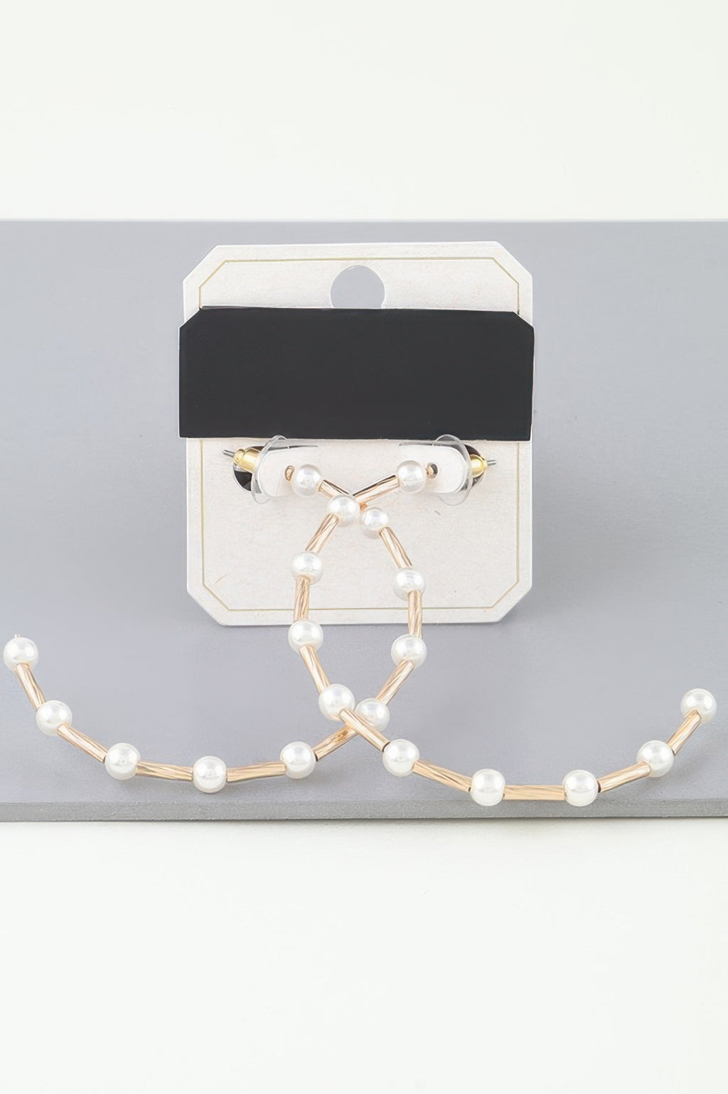 Twisted pearl open hoop earrings with cream faux pearls on gold-tone hoops