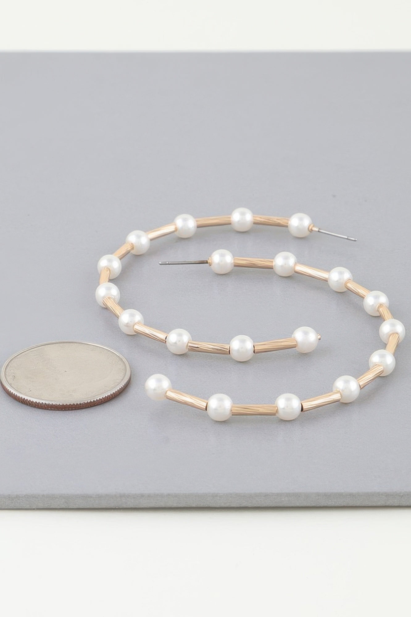 Twisted pearl open hoop earrings, gold-tone with cream pearl beads and posts