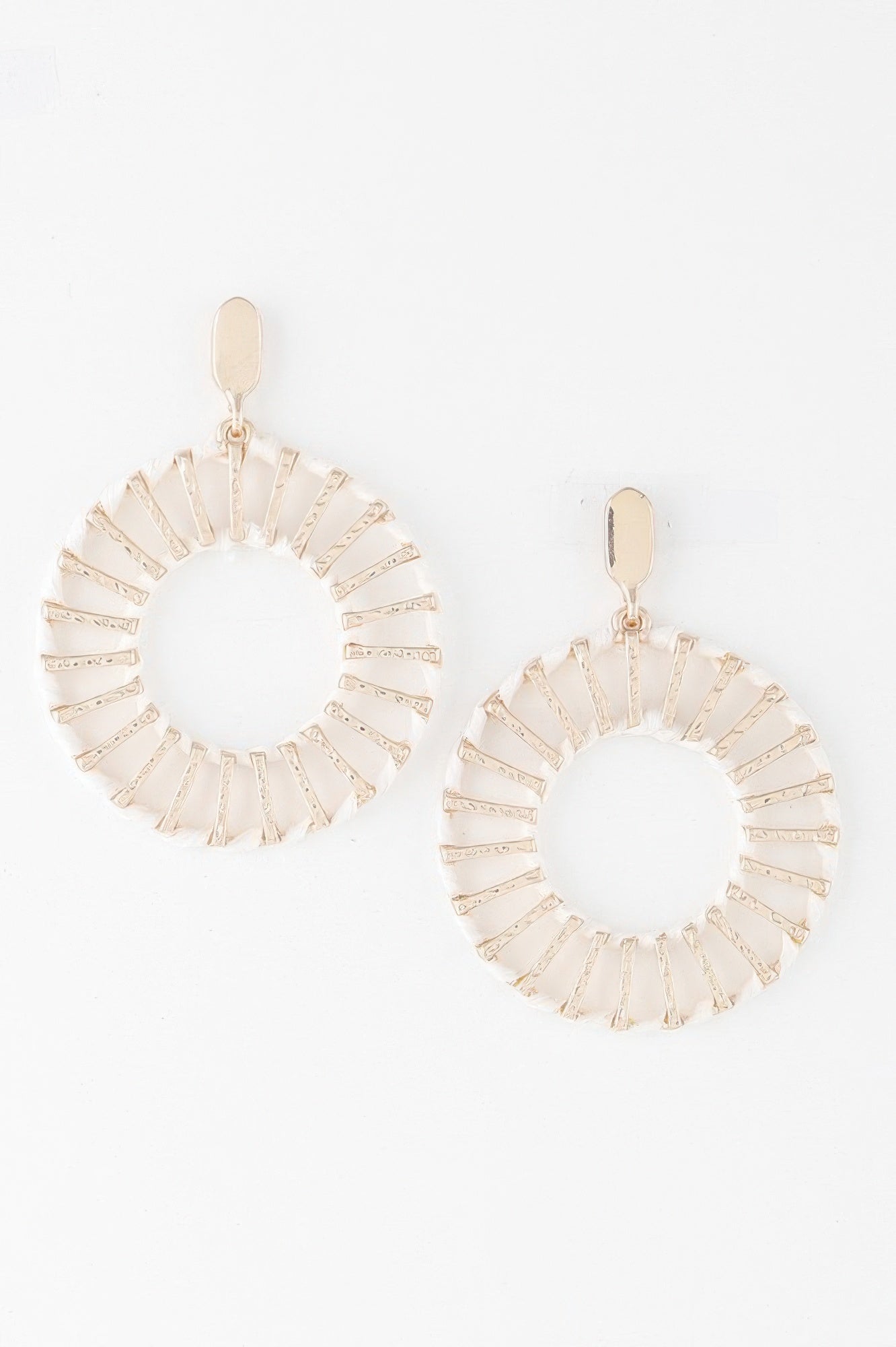 Twisted woven disk earrings in ivory with gold tone and cream striped detail