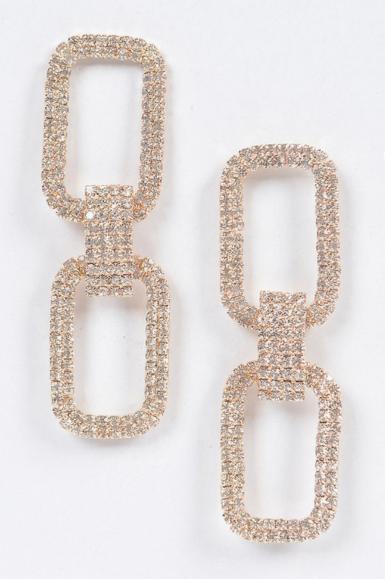 Two rectangular rhinestone earrings, gold-tone settings with linked square bars