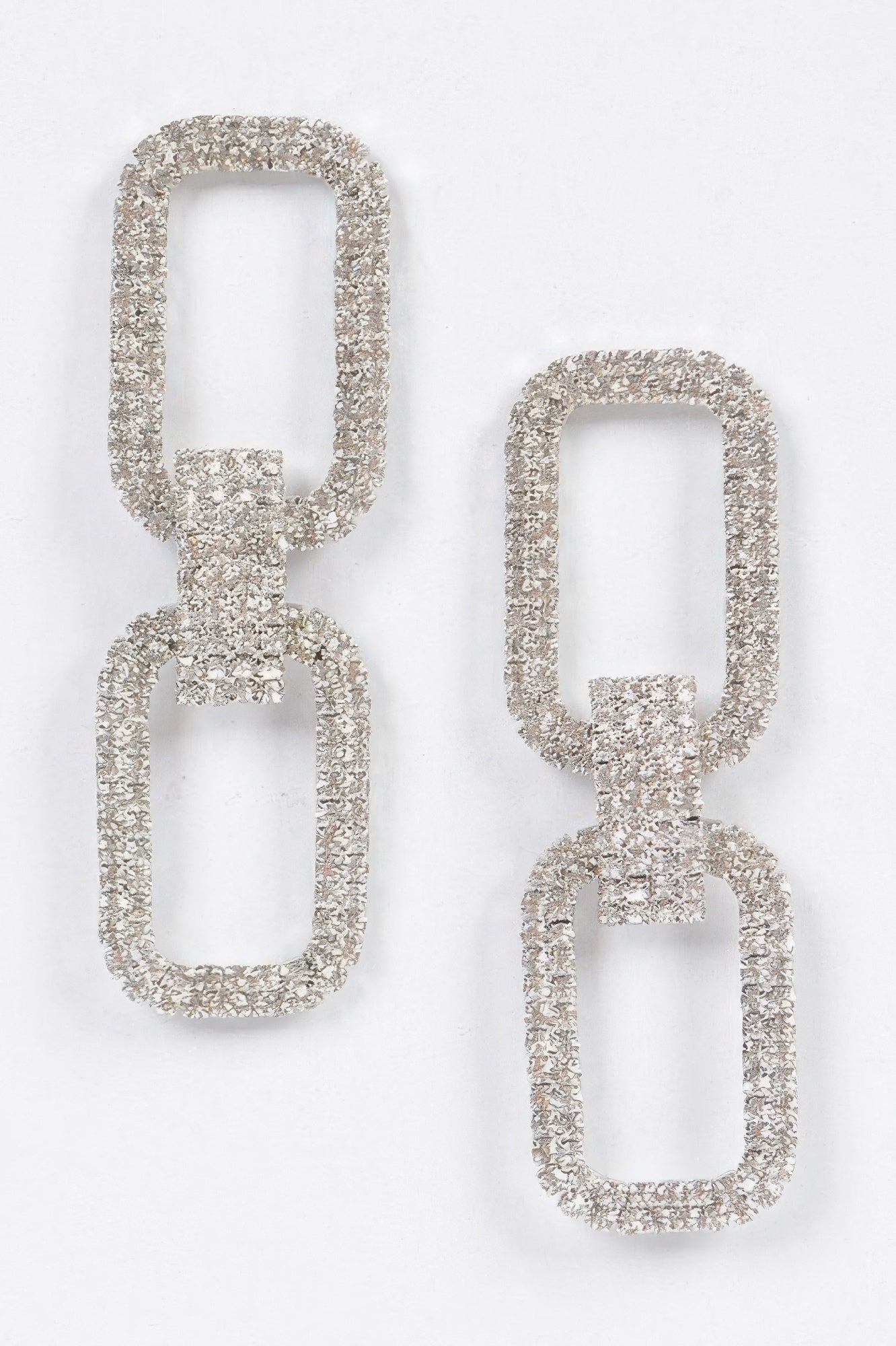 Two rectangular rhinestone earrings, silver-tone settings with linked square bars