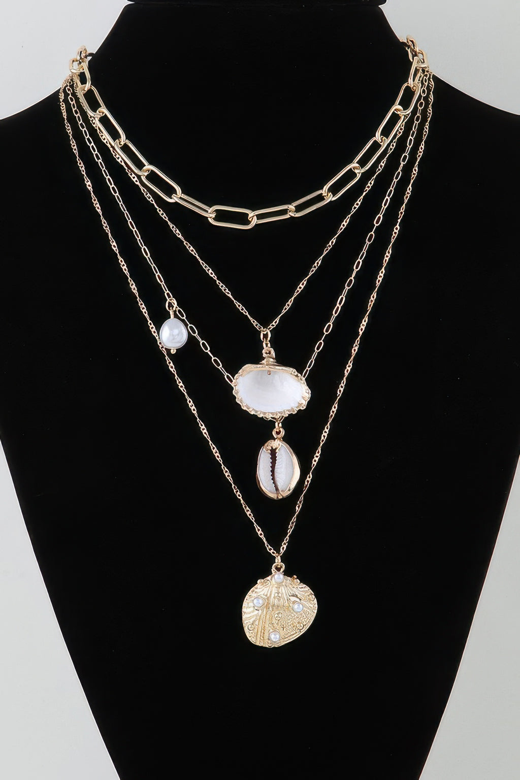 Under The Sea charm chain necklace: gold-tone layered chains with shell charms and drops