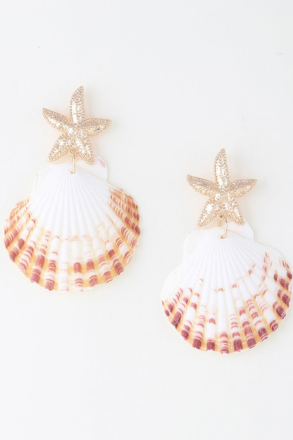Gold-tone starfish and white scallop shell drop earrings with pink shell print tiers