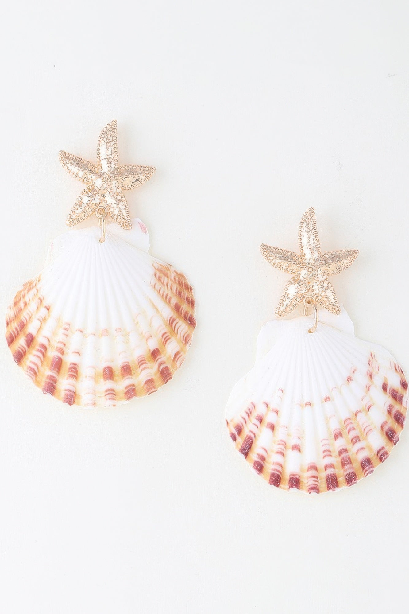 Gold-tone starfish and white scallop shell drop earrings with pink shell print tiers