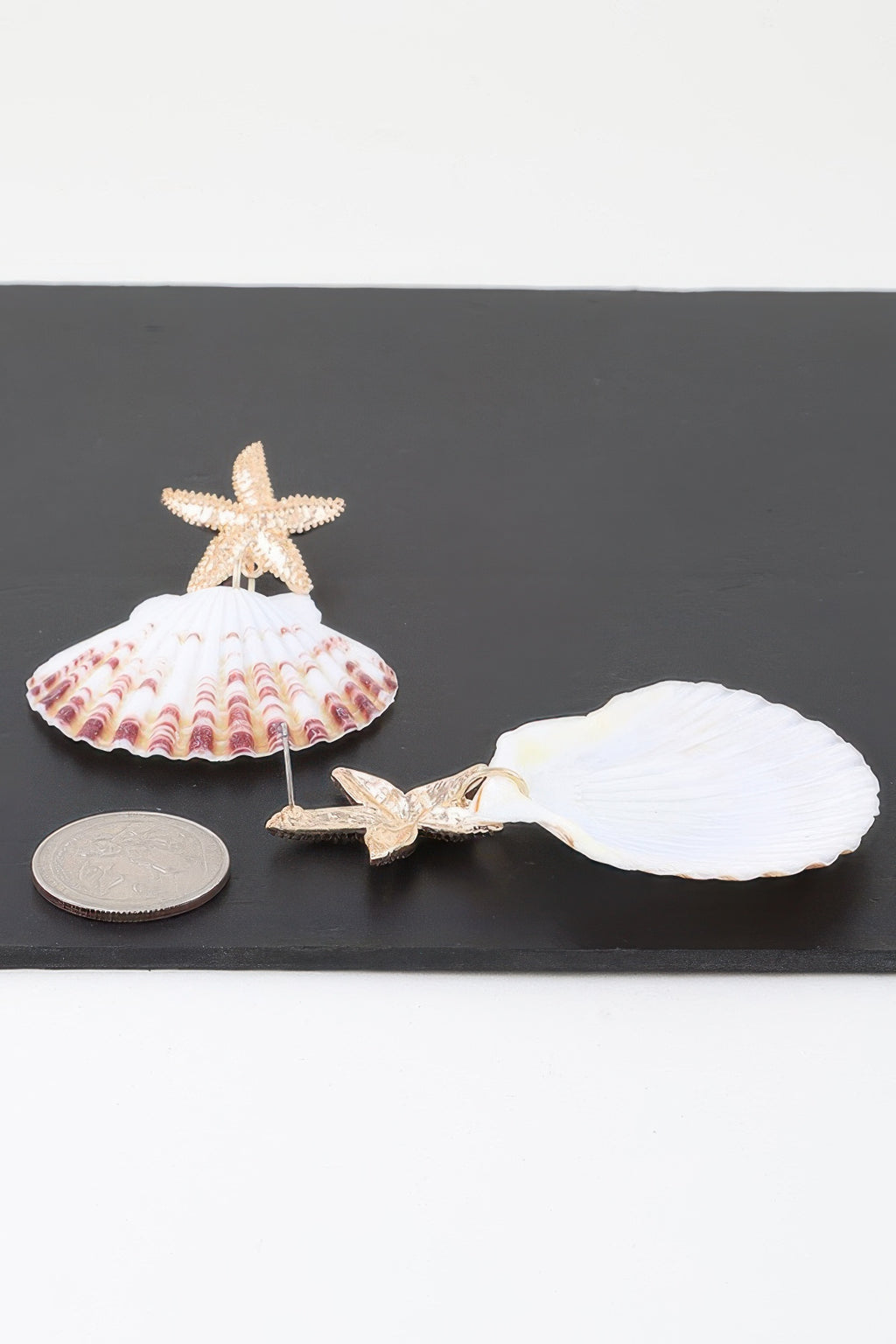 Starfish and shell dangle earrings: gold-tone hooks with white scallop shell drop
