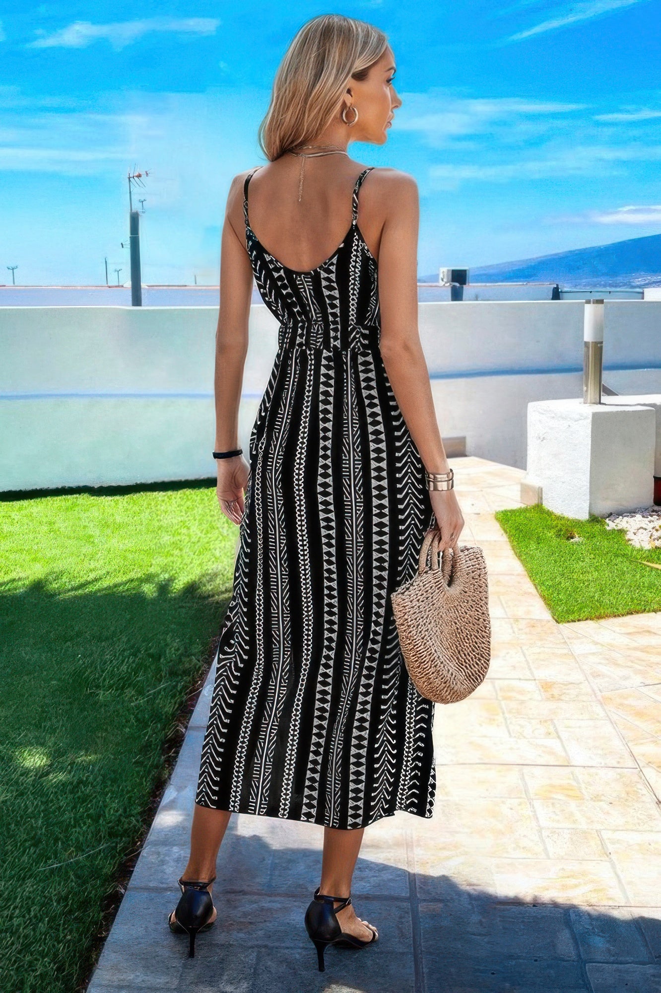 Back view: V-neck geo print split-thigh sleeveless cami dress in black/white stripes