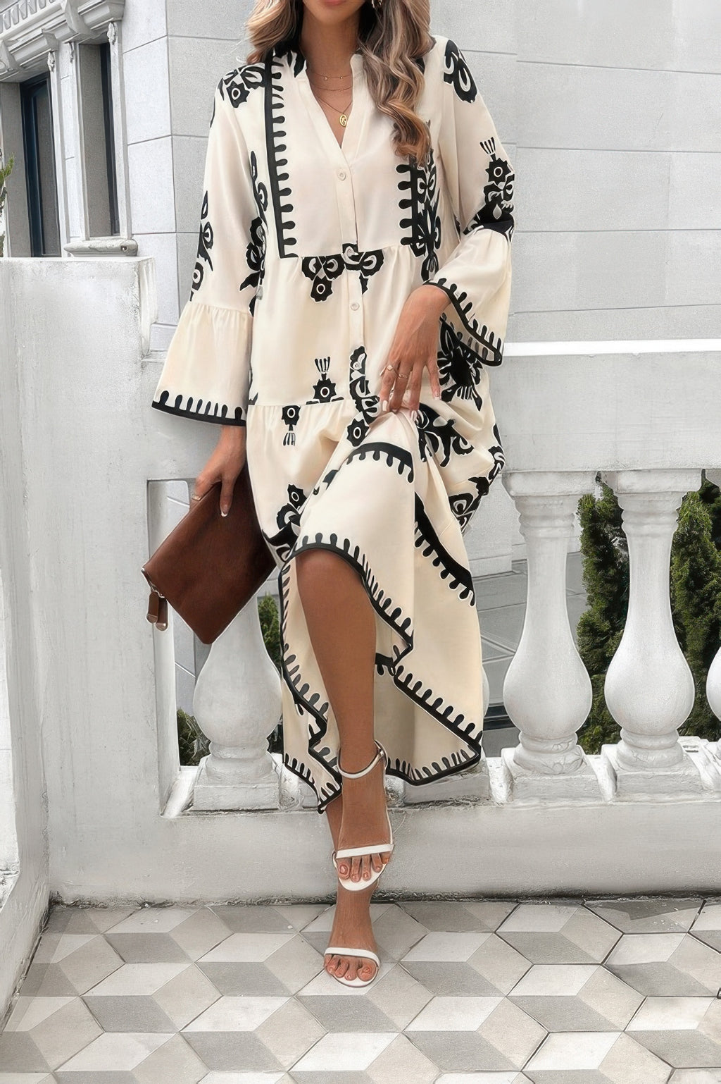 Cream button-front midi dress with V-neck and stand collar; black floral print with contrast trim