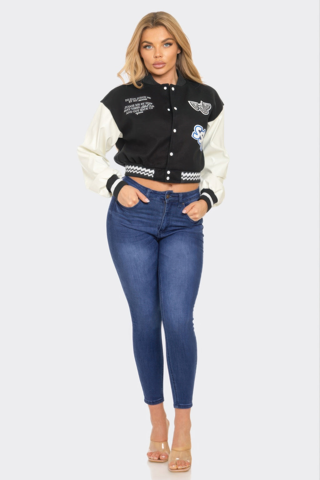 Varsity patchwork Y2K jacket, black body with off-white sleeves, snap front, trim