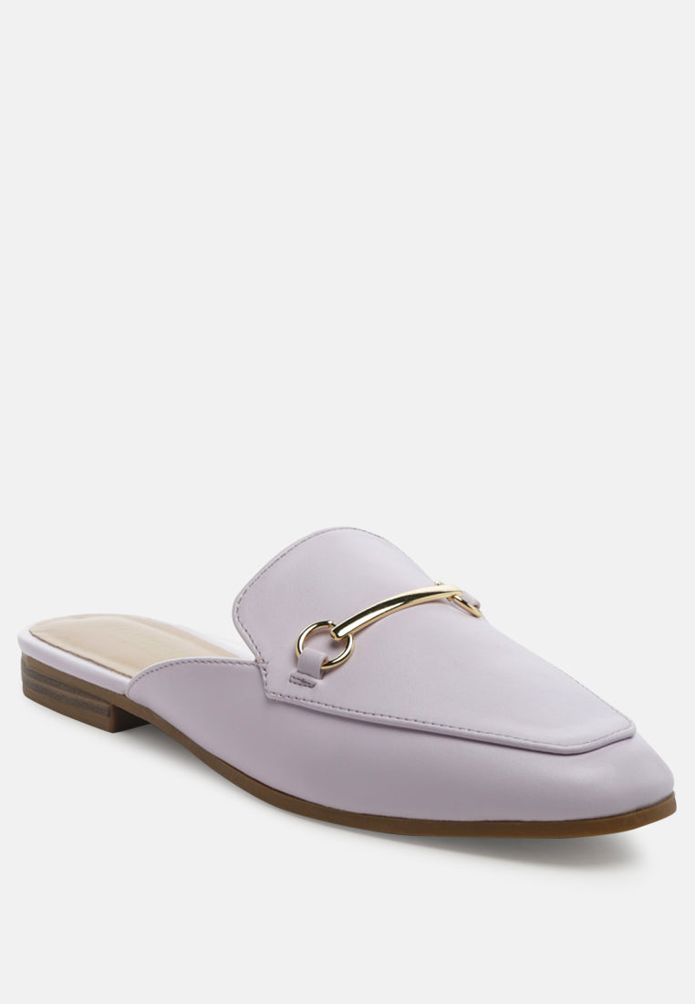 Lavender purple mules with gold-toned horsebit detail and brown sole