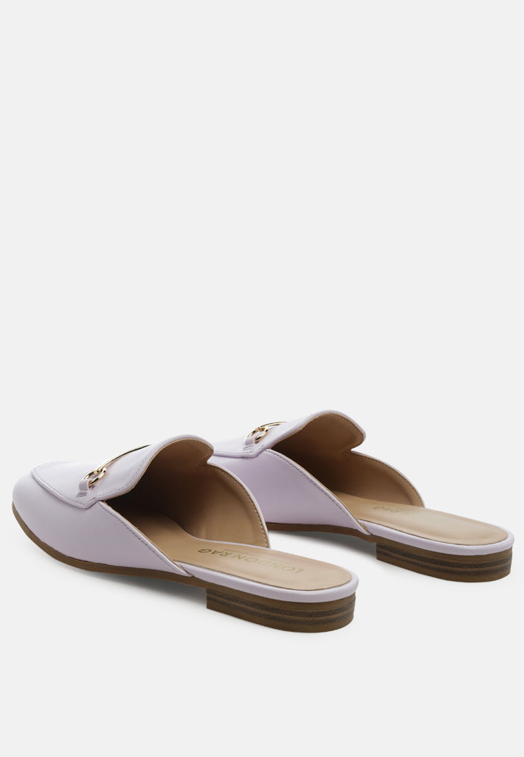 Purple slide mules showing open vamp and low heel sole