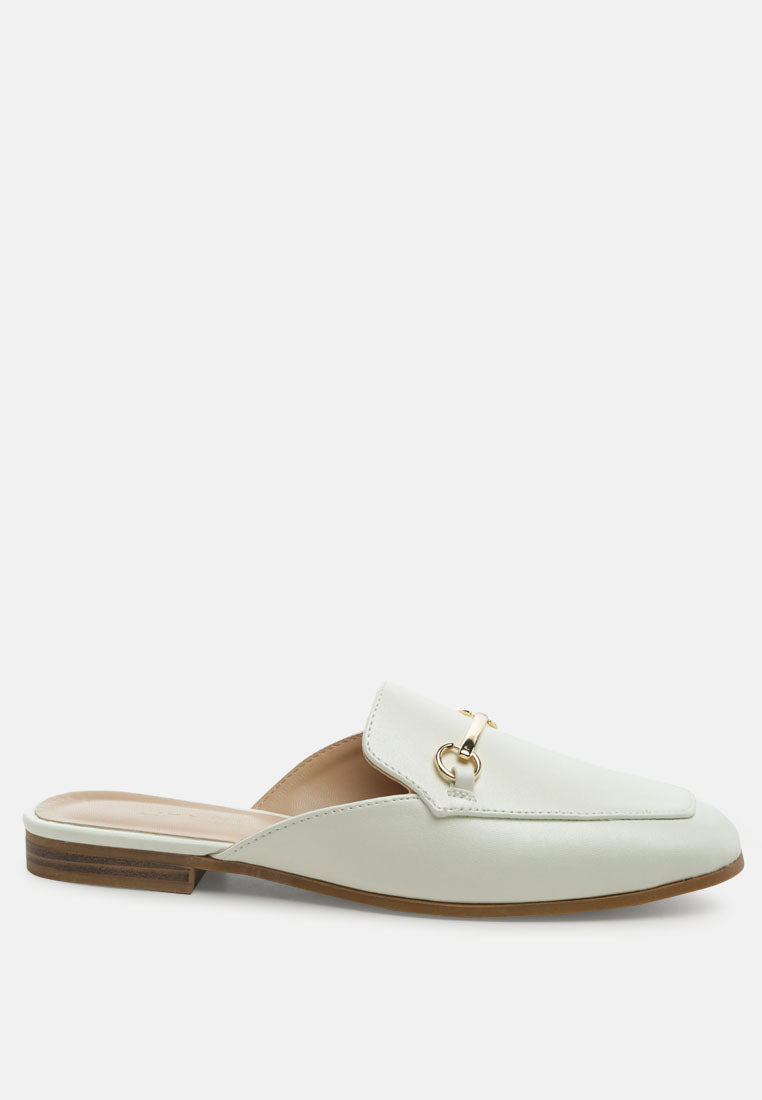 White faux leather flat mules with gold-toned horsebit detail