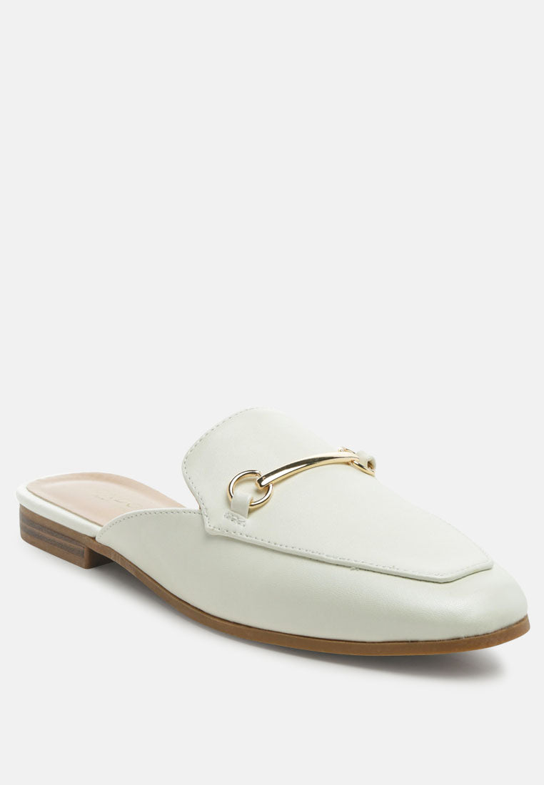 White slip-on mules with gold hardware and low block heel