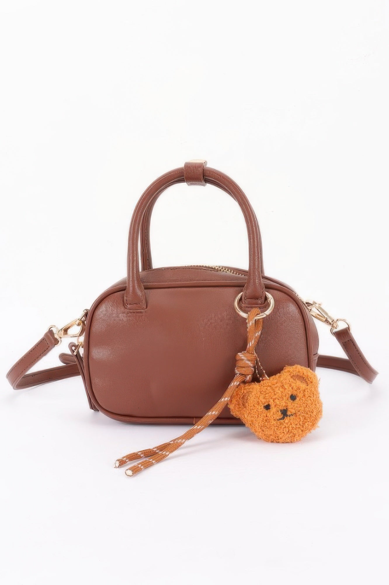 Vegan leather mini bowling bag in camel with bear charm and shoulder strap