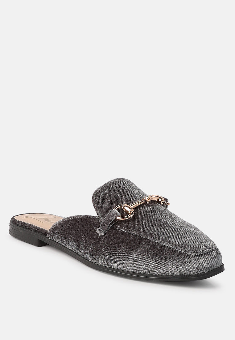 Grey velvet slide mule with gold-tone buckle at the vamp
