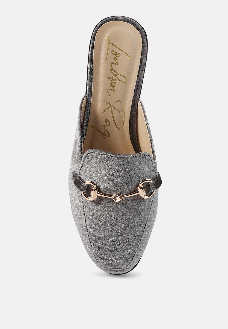 Grey velvet mule front view with gold-tone buckle and padded collar