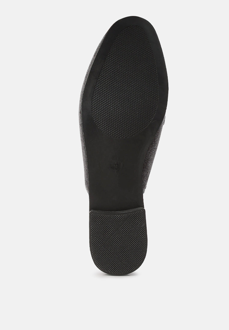 Black velvet flat mule with textured outsole and rounded toe