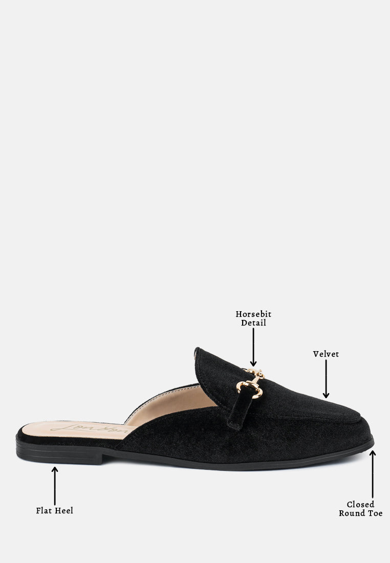 Black velvet buckled flat mules with horsebit detail, closed round toe and flat heel