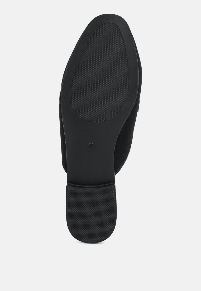 Black velvet mule heel view with textured tread outsole