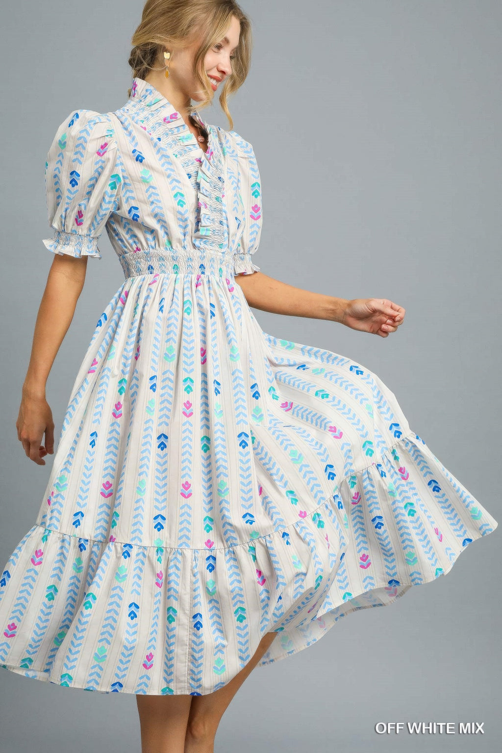 Colorful printed smocked midi dress with puff sleeves and tiered ruffle hem, side view