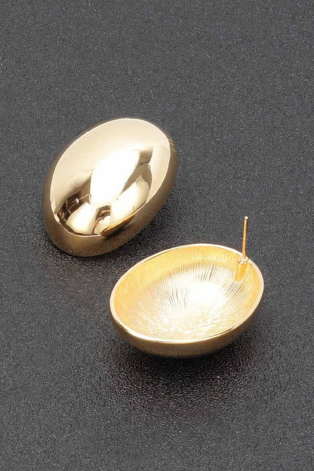 Vintage gold-plated earrings with domed disc front and visible post back