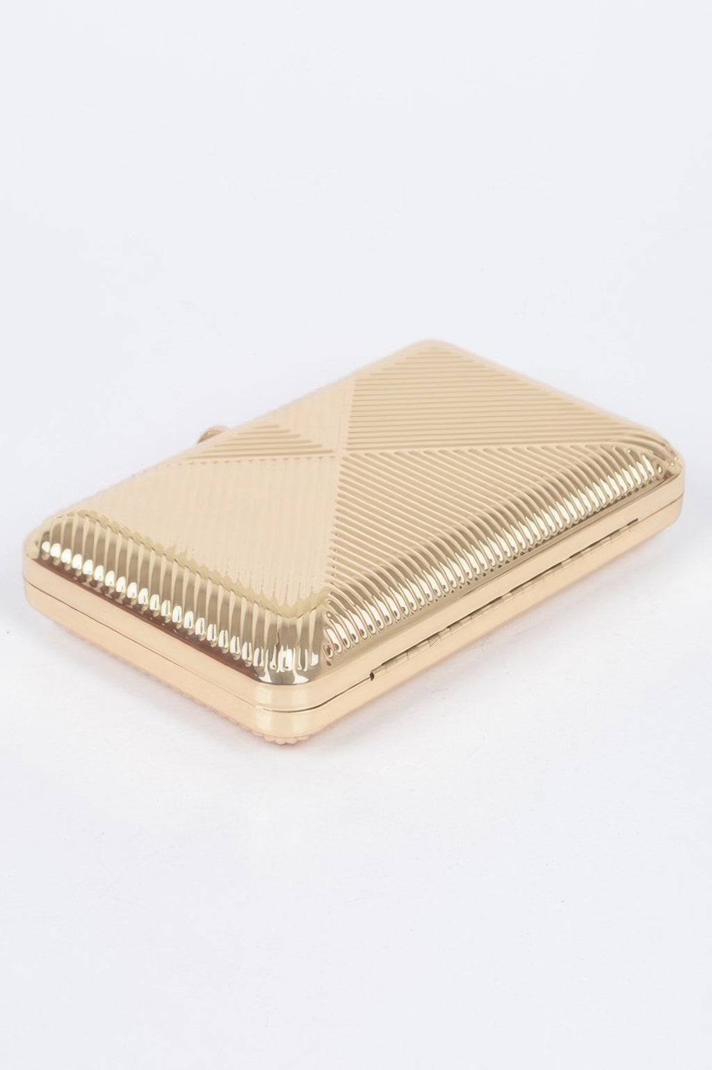 Gold ribbed metal clutch, top clasp and hinged frame, closed