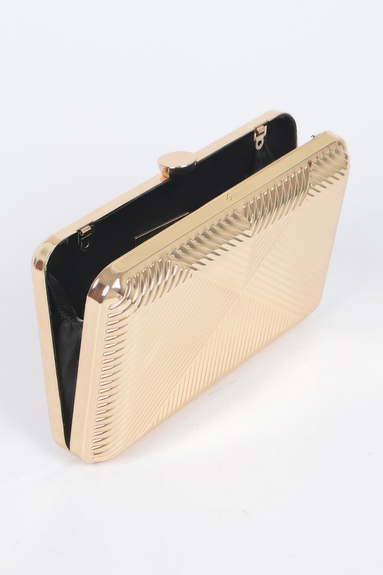 Gold vintage metal clutch with hinge clasp, black interior, ribbed front