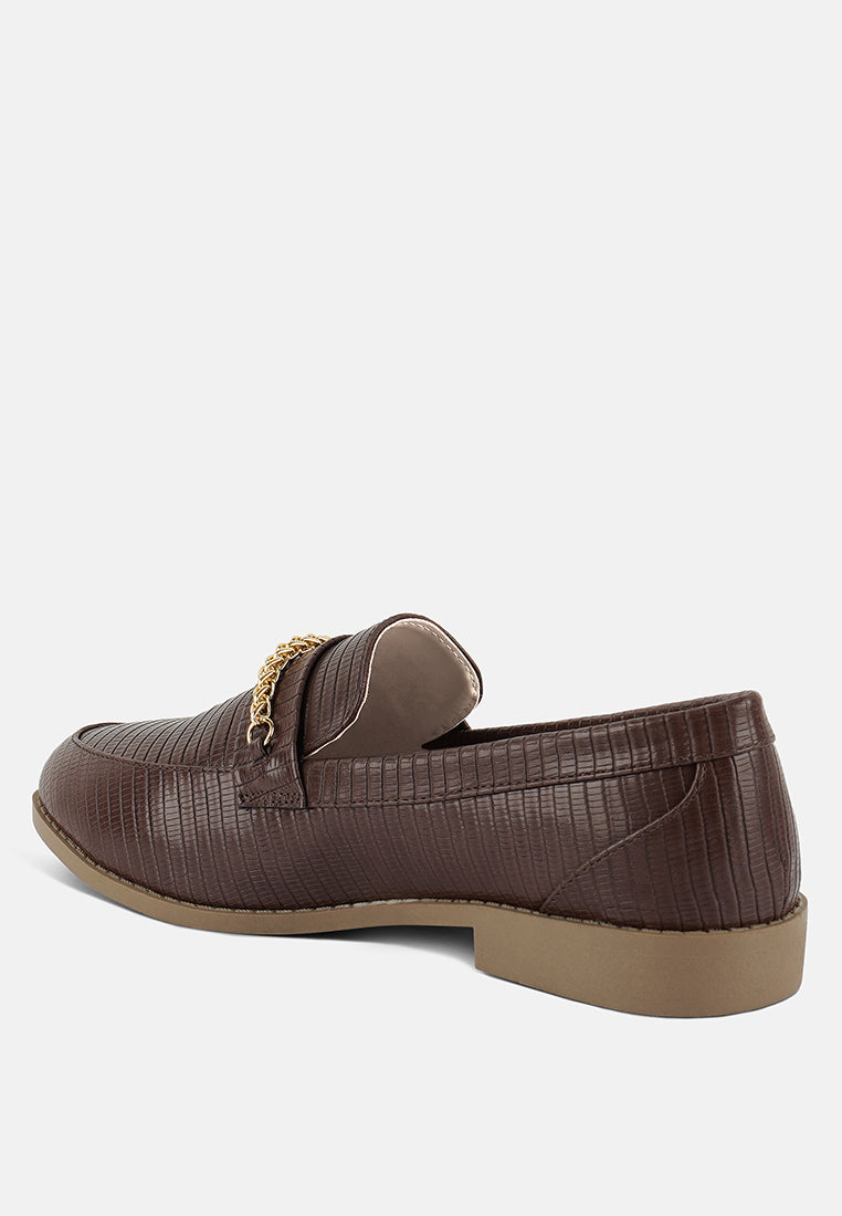 Dark brown loafer rear side with gold chain detail and almond toe