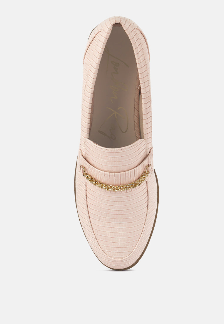 Nude slip-on loafers with gold chain, shown open toe opening
