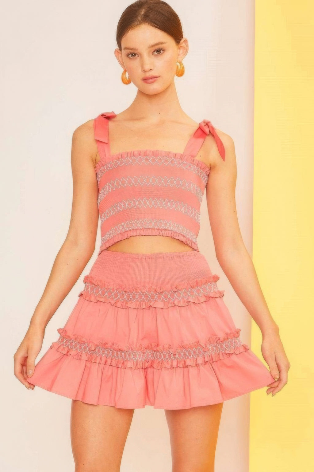 Coral waist-smocked ruffle mini skirt with layered ruffles and zigzag trim