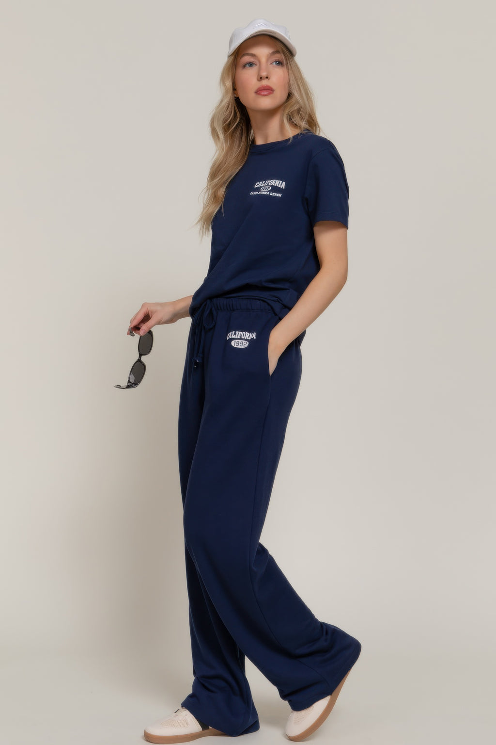 True navy sweatpants with “CALIFORNIA 1992” logo on the thigh and side drawstring waist