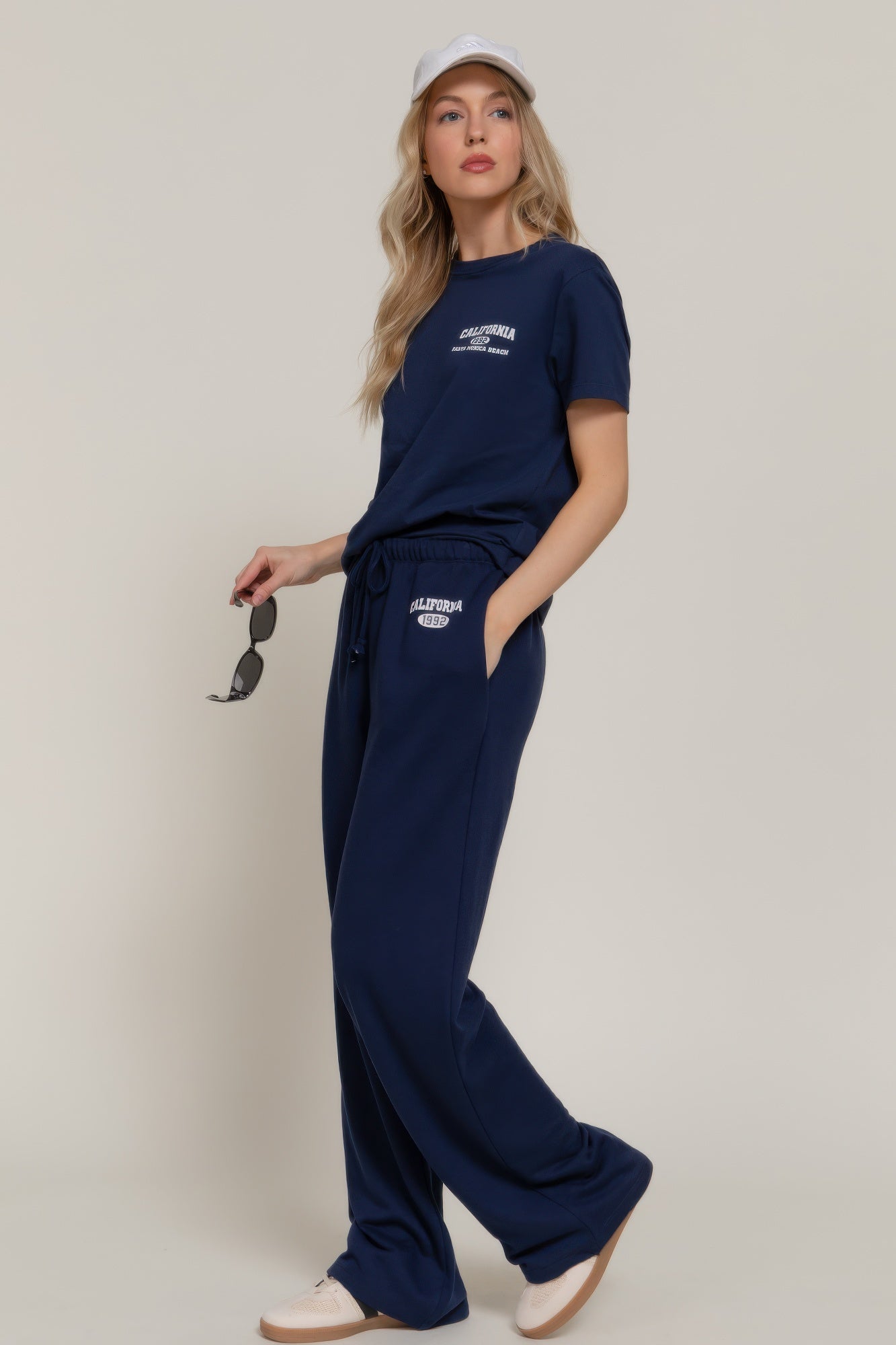 True navy sweatpants with “CALIFORNIA 1992” logo on the thigh and side drawstring waist