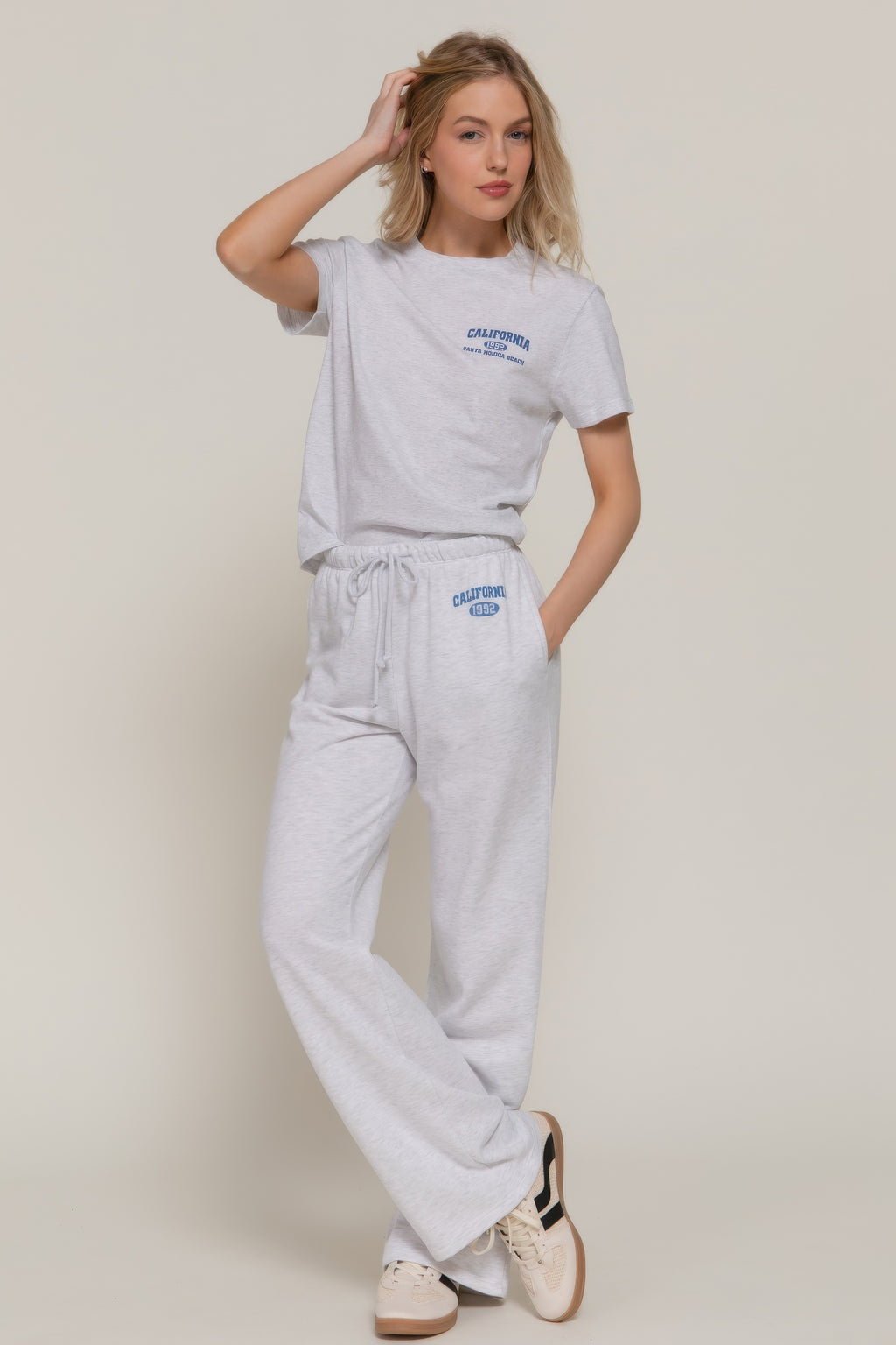 Grey-marl sweatpants set look: drawstring waist and “CALIFORNIA 1992” logo on leg